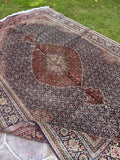 Persian medallion rug from Tabriz with a detailed Mahi pattern, luxurious wool pile and subtle silk highlights.