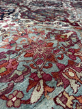 Antique Persian area rug 7'6 x 10' featuring a fine Kerman Lavar weave, ivory field and detailed floral lattice design.