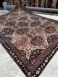 Antique ivory Persian rug 7'6 x 10' with a Kerman Lavar floral lattice pattern and rich natural-dyed blue, red and taupe tones.