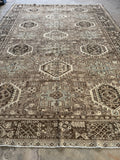 Decorative Persian Heriz tribal rug with geometric pattern on a neutral background