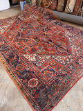 Antique Persian Heriz rug 8x11 hand knotted vegetable dyed wool area rug in rich red and navy.