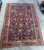 9x12 navy blue antique Heriz rug with hand-knotted vegetable dyed wool and graphic tribal design.