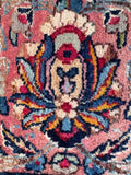 Close up of floral motif within border band. 