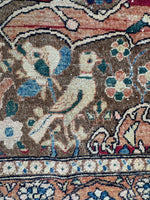 Bird motif in antique rug