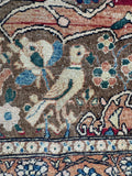 Bird motif in antique rug