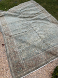 Persian Tabriz wool rug from the 1940s featuring crisp floral details, an allover lattice design and soft neutral greens.