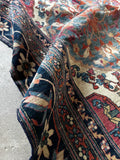 Antique Kerman rug from the late 19th century with large-scale medallions, intricate botanical details and an ivory ground.
