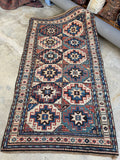 Antique Tribal Kazak Rug Hand knotted Caucasian Kazak wool runner with eight pointed star motifs. 