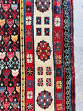 Vegetable-dyed tribal runner with brick red, teal, ivory and apricot details.
