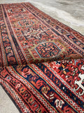 Border on Skinny vintage persian tribal runner
