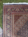 Vintage Tabriz Persian rug 6'7 x 9'7 with a large medallion, fine weave and intricate allover floral detailing.