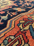 Close-up of a vintage persian rug with intricate designs.