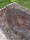 Persian Mahi rug 6'7 x 9'7 from Tabriz featuring a finely woven water garden pattern and large central medallion.