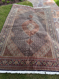 Vintage Persian Tabriz rug 6'7 x 9'7 with a fine weave, central medallion and intricate Mahi water garden design.