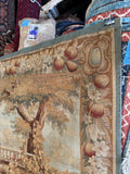 Corner view of fruit and floral border detail on 19th century French tapestry.