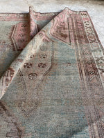 small distressed persian rug