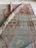 small distressed persian rug