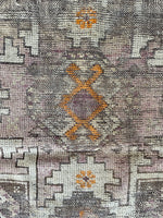 worn antique rug