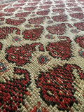 1920s Persian rug with repeated seed of life motifs on bone ivory background

