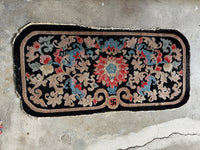 Antique Chinese rug with central swastika and floral medallion, handwoven wool circa 1920s

