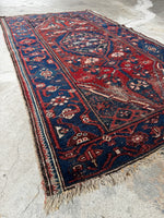 Small antique tribal Persian rug with faded medallion design and geometric border, 3'3 x 6'4

