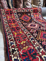 Bright red border with stylized crab motifs.