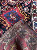 Folded corner of Kazak rug showing thickness, weave, and craftsmanship.