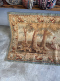 One end view of pictorial scene and botanical border on fine antique textile.