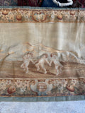 Cherub-like children dancing in historic French woven textile.