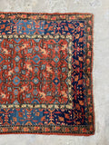 Abrash blue wool detail on early 1900s Persian rug.