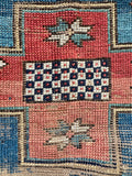 Aqua blue Kazak runner rug showing natural abrash color shifts from hand-dyed wool batches.