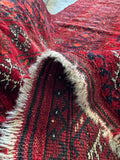 Fringe and edge detail of a vintage Afghani tribal rug.