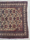 Antique Afshar rug with multiple layered borders and rosette motifs.