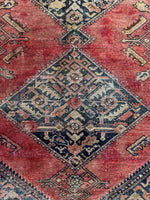 Center field of Afshar rug showing bold graphic designs.