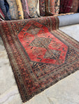 Rare square-shaped tribal Persian Afshar rug on display.