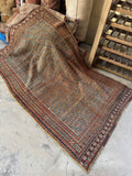 Full length view of tribal Afshar rug with deep history and vegetable dyed color.