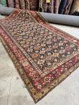 Antique Caucasian rug with rare charcoal ground and lattice design.
