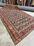Antique Caucasian rug with rare charcoal ground and lattice design.
