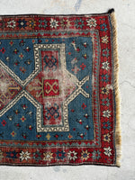 1900s Caucasian rug with fertility and happiness star motifs.