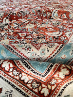 Agra rug folded to show flexibility and weight