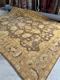 Handwoven mid century Agra rug in neutral brown and beige tones.