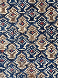 Close-up of low pile antique Persian Baluch rug 