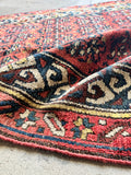 Close-up of soft vegetable-dyed wool pile on antique Persian Kurdish runner rug