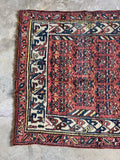 End detail of antique Persian Kurdish runner showing ivory and navy border finish