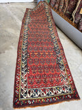 Antique red rust Persian Kurdish runner rug 4x12, allover shrub field with navy ivory border, full view