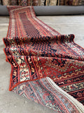 Skinny antique Persian runner rug 3x12, midnight navy boteh field with rust red zigzag frame