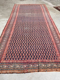 Antique Persian rug with all-over small-scale boteh paisley on midnight navy ground, circa 1920s, gallery size 4'9 x 9'10