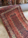 vintage wool Persian Malayer runner rug field detail showing pistachio green and rust red boteh motifs