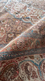Low wool pile and scattered wear on a finely woven vintage Persian Tabriz rug.