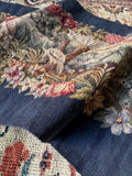 Close-up view of pastoral antique French tapestry.